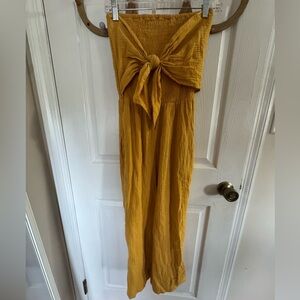 NWOT Mustard Yellow strapless Jumpsuit with Bow Detail